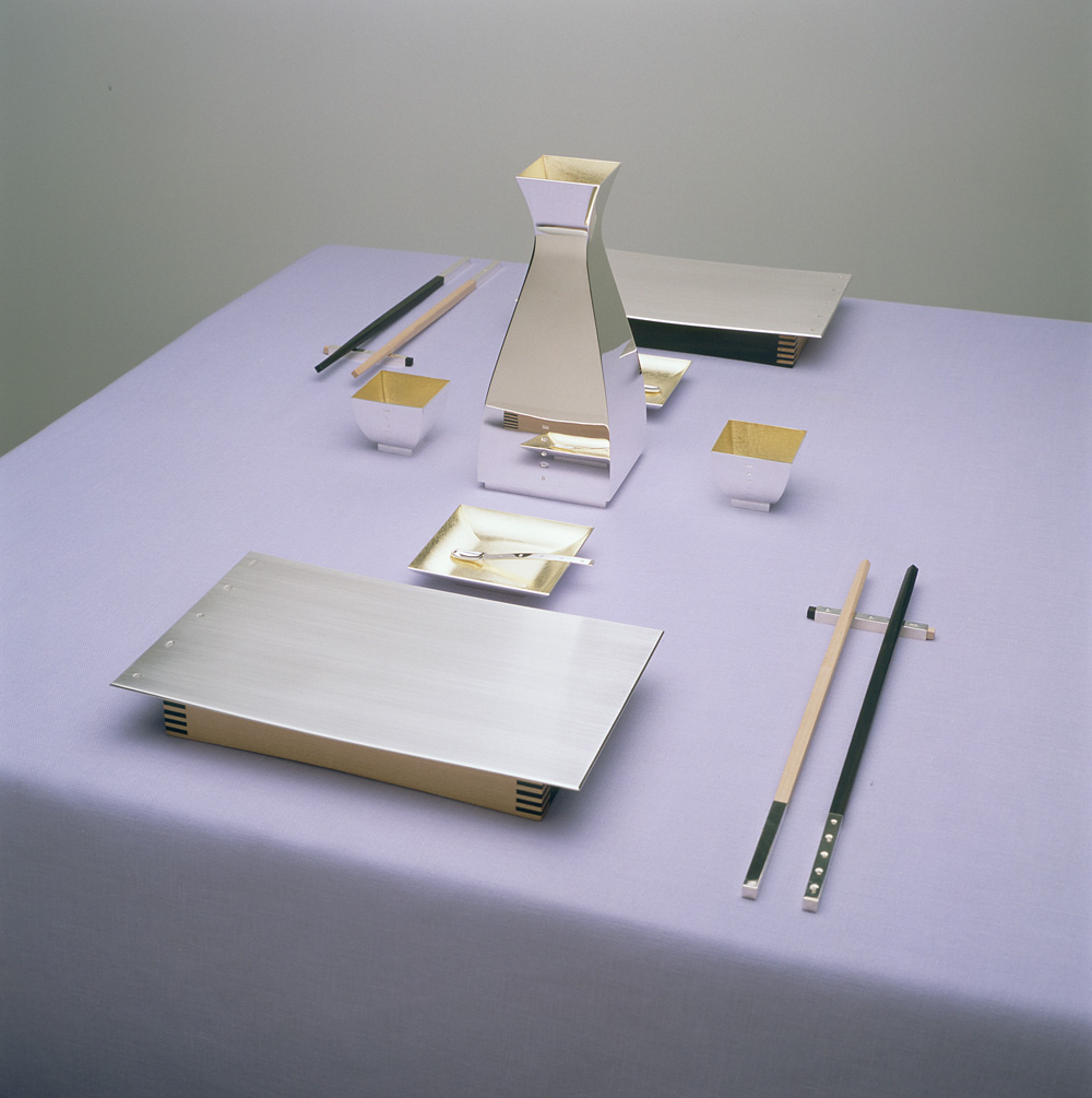 Sterling silver, lemon yellow gilding, maple and ebony. Sushi plate 195x120x30mm, sake vessel 165mm high x 70mm square, wasabi dishes 70mm square, sake cups 40mm square. Photo: Joel Degen