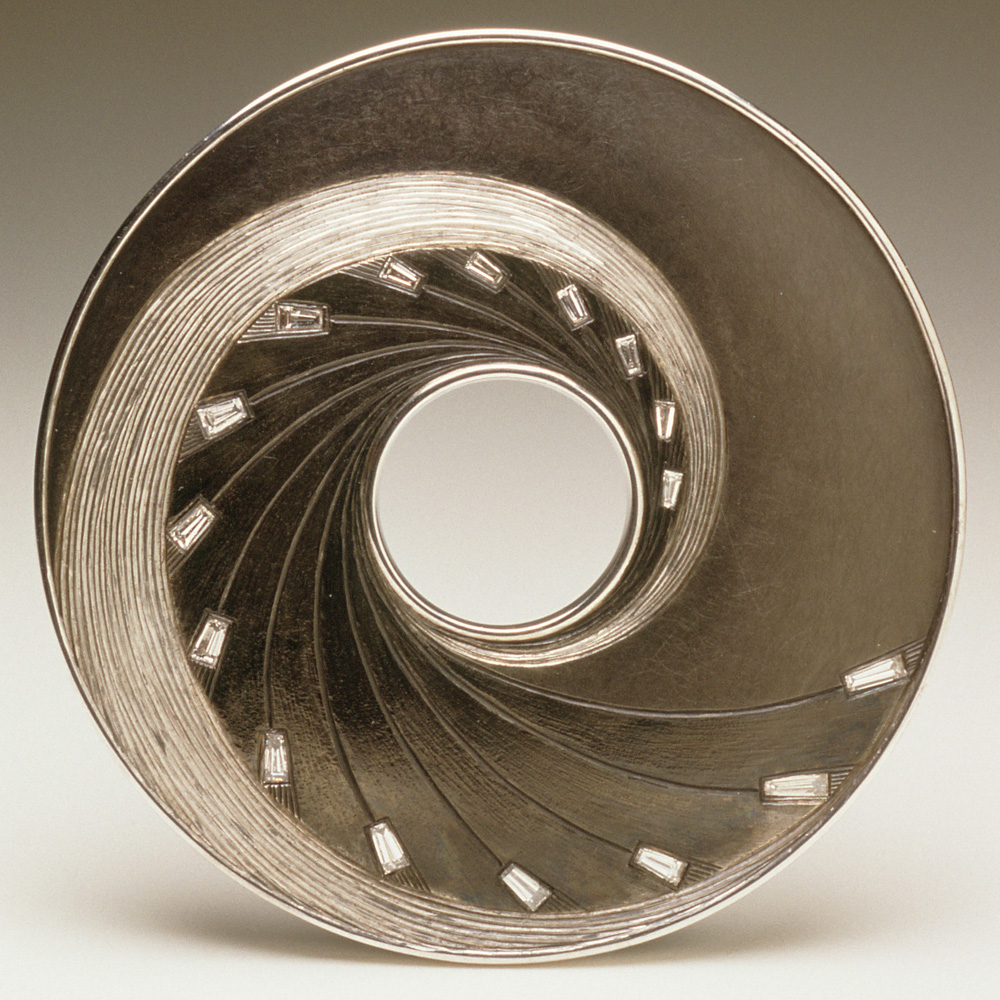 18ct white gold, oxidised silver, rhodium plate, tapered baguette white diamonds. 6cm diameter. Photo: Joel Degen 