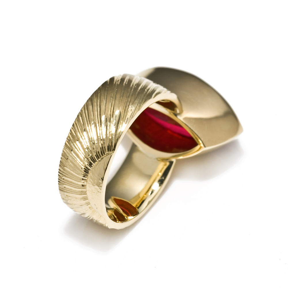 <a href="/jewellery/reverse-detail-2">Reverse detail: Dress Ring, 2008. 18 ct gold, shank engraved with rising sun motive. Set with marquise rubelite tourmaline. Photo : Simon Armitt</a>