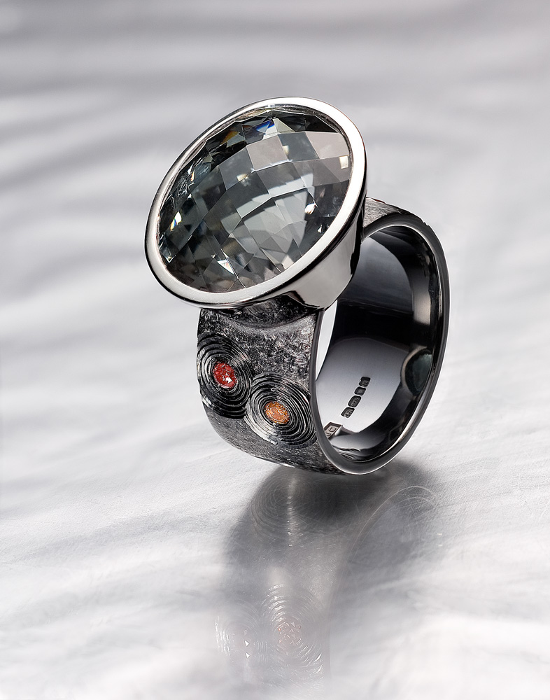 Silver, hand engraved, black rhodium plate, oval chequerboard cut grey/green tourmaline, pink diamonds. 2008/9.Photo: Simon B Armitt