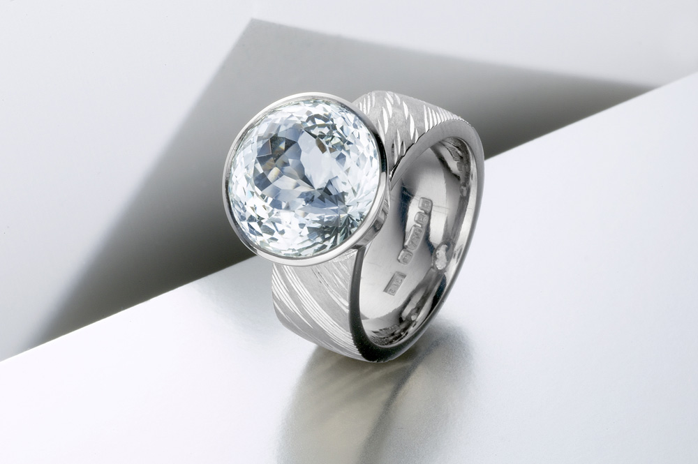 18ct white gold, hand engraved, royal cut aquamarine. Photo: Paul Hartley