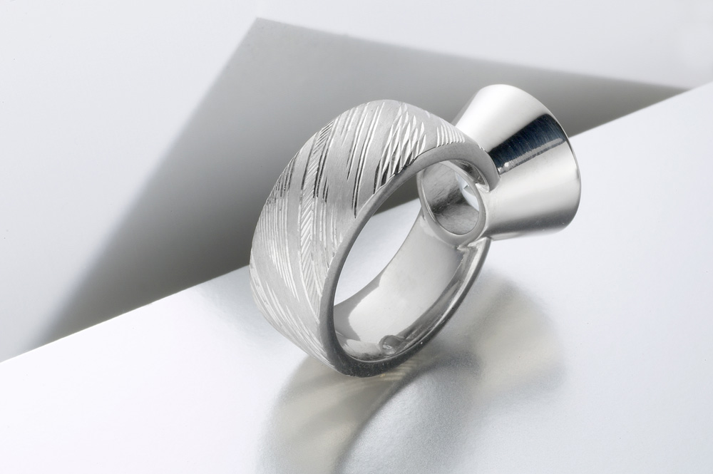 18ct white gold, hand engraved, royal cut aquamarine. Photo: Paul Hartley