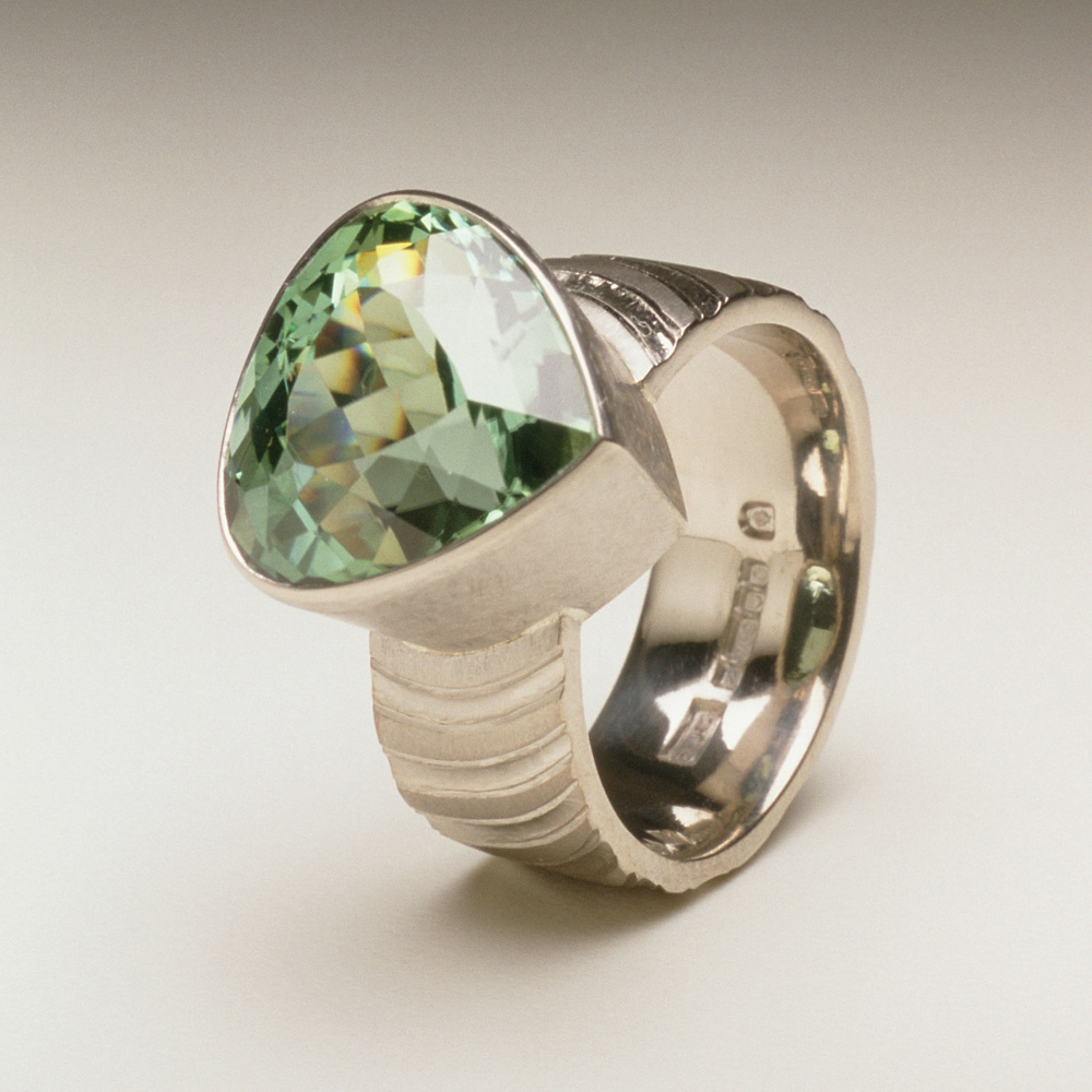 18ct white gold, hand carved and engraved, pale green tourmaline.