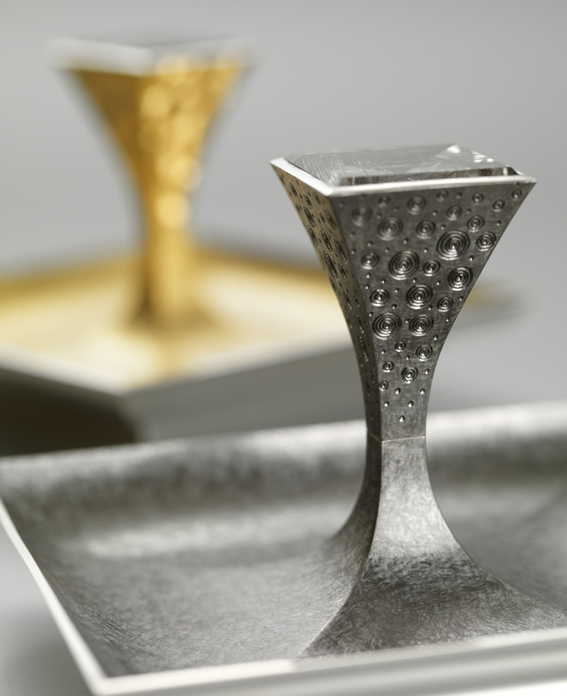 Silver, hand engraved, yellow gilding, black rhodium plate, set with pair of square mirror cut rutilated quartz. Dishes 88mm square. Made for 'Silver with a Pinch of Salt' exhibition at Goldsmiths. 2009. Photo: courtesy The Goldsmiths' Company.