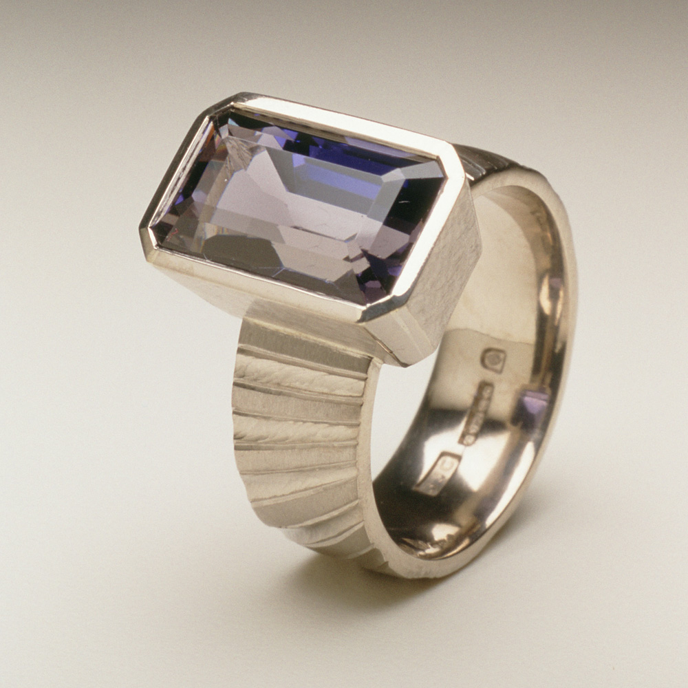 18ct white gold, hand carved and engraved, set with a baguette Iolite. Inspired by pillars of the nave of Durham Cathedral. 