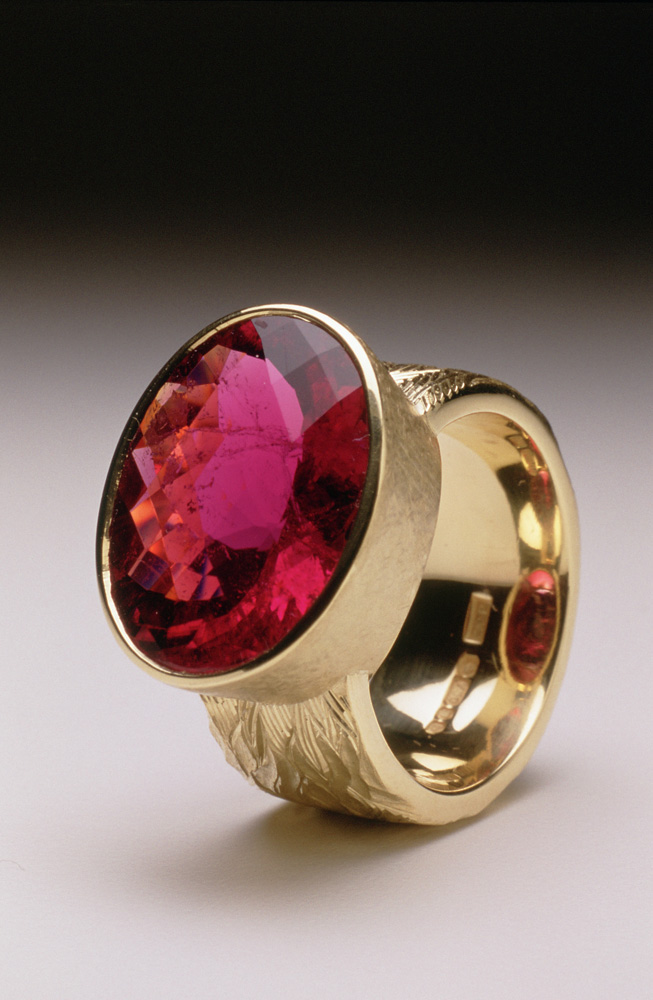 18ct yellow gold, hand carved and engraved, red oval chequerboard rubelite tourmaline.
