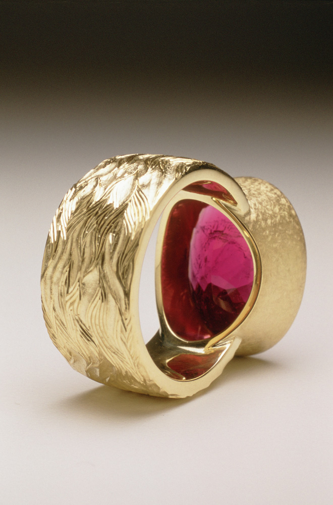 18ct yellow gold, hand carved and engraved, red oval chequerboard rubelite tourmaline.