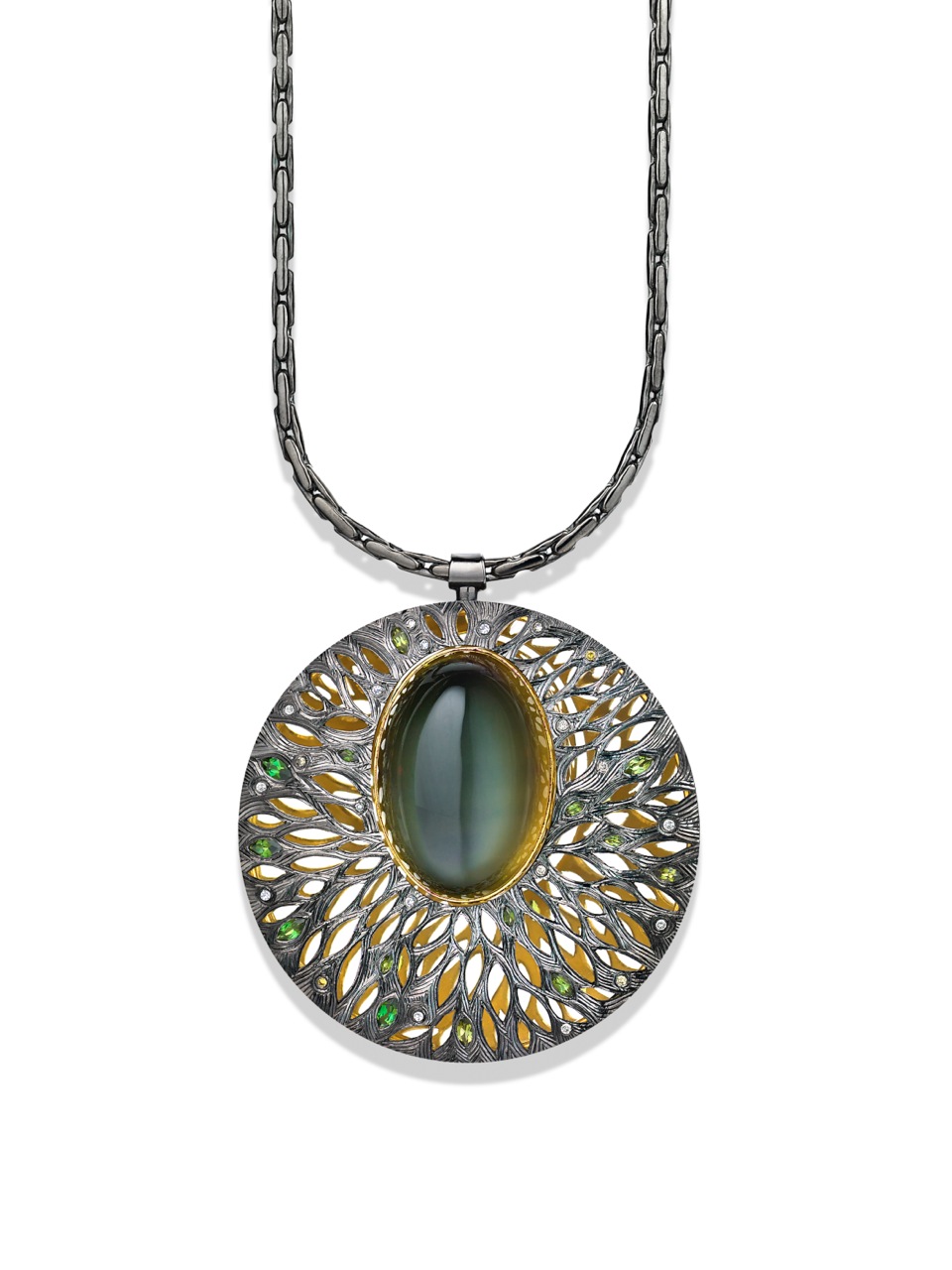 Silver, hand engraved and pierced with moonstone set in green gold, with green tourmalines and grey diamonds. (Commission)