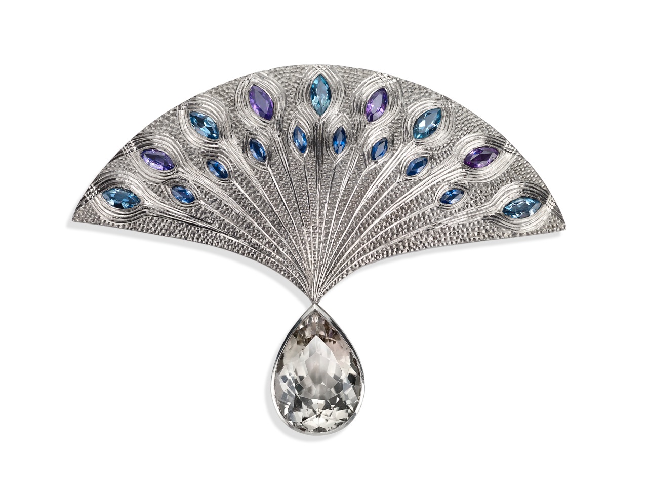 18ct white gold, hand engraved, set with purple/blue sapphires, aquamarines, and pear-shaped drop white sapphire. 