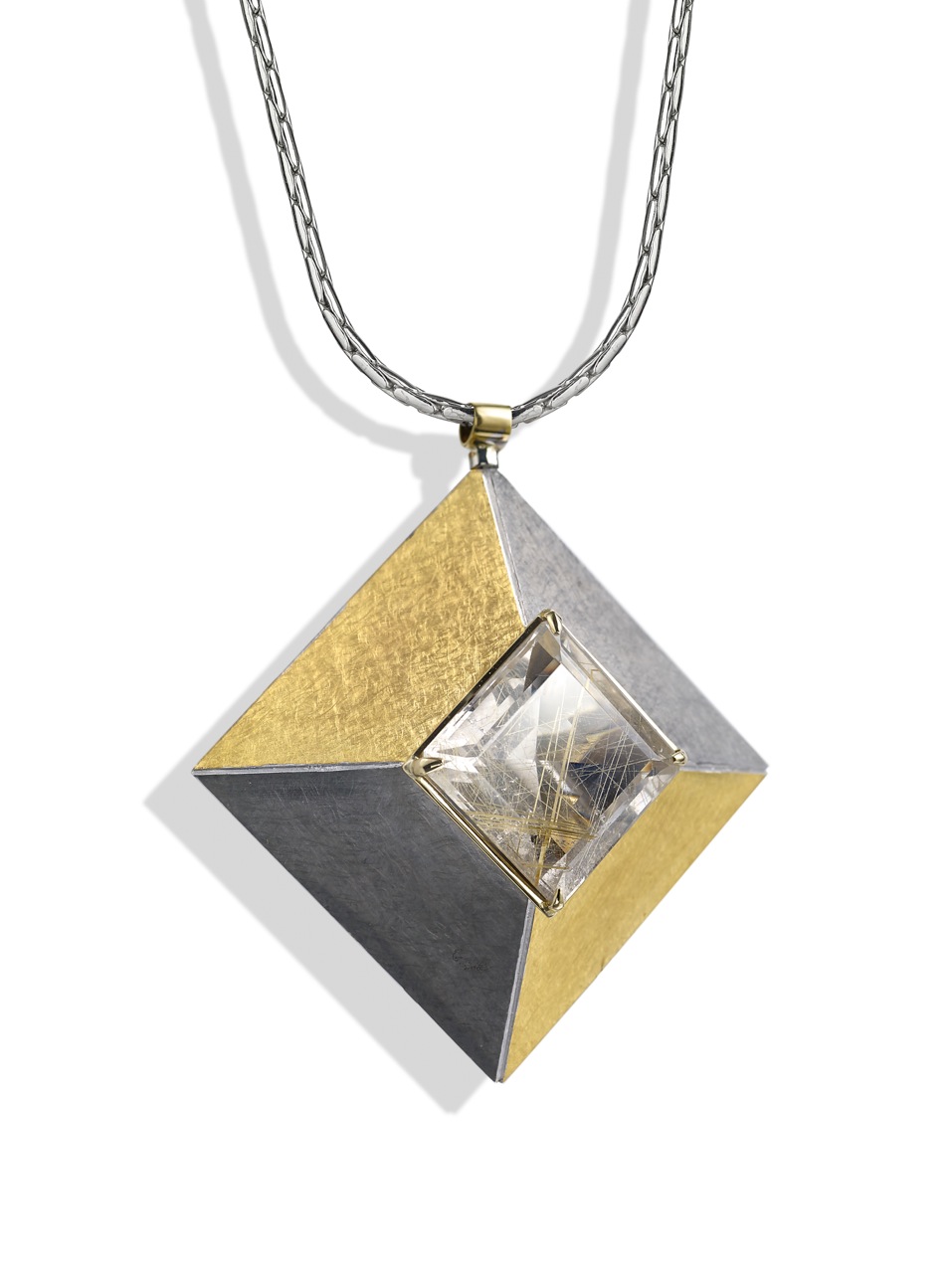 <a href="/node/262">Cardinal Points :  Silver 5.0cm square, scrubbed finish finished in Black Rhodium and gilding,  stone setting 18ct gold, stone Rutilated Quartz . View 2 : side on showing truncated pyramid form. </a>