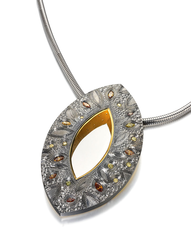 Silver, hand engraved, set with brown, yellow and green treated diamonds - finished in grey rhodium plate and 18ct gilding.