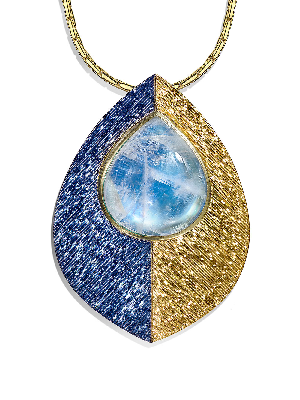 Silver and 18ct gold, gilding and rhodium plate, hand engraved, set with drop cabouchon moonstone. Photo: Simon B Armitt 