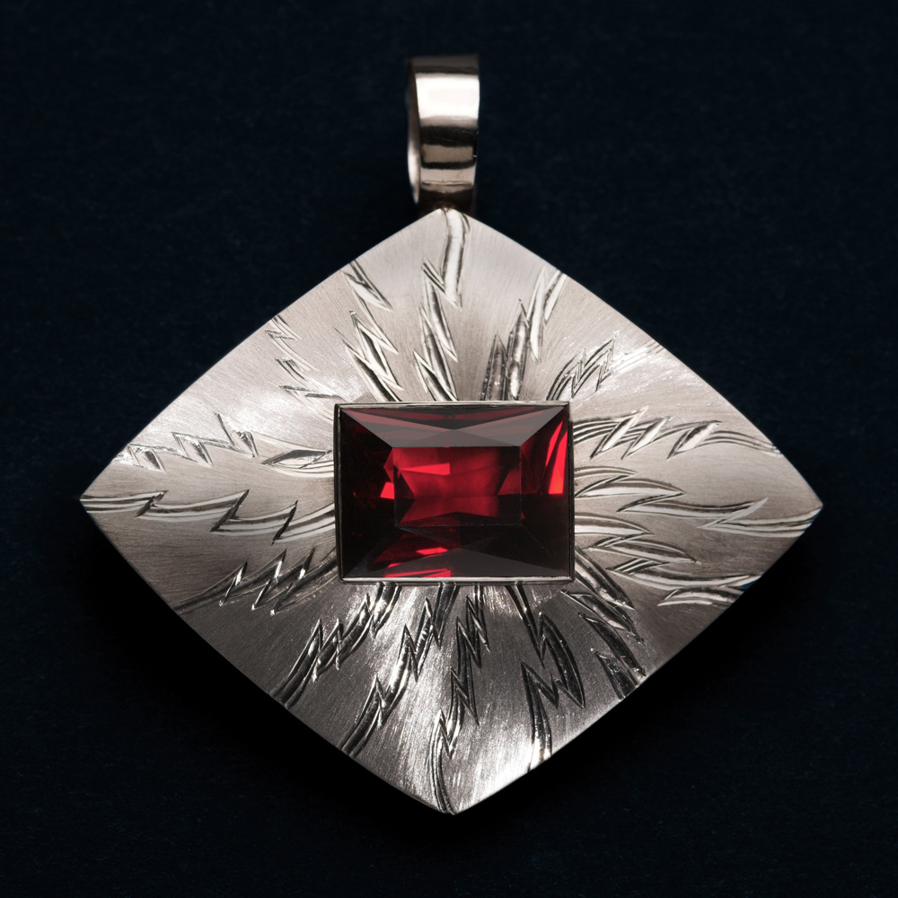 18ct white gold, hand engraved, carved and striated, rectangular garnet 18.77cts. 6cm x 6cm.Photo: Simon Armitt