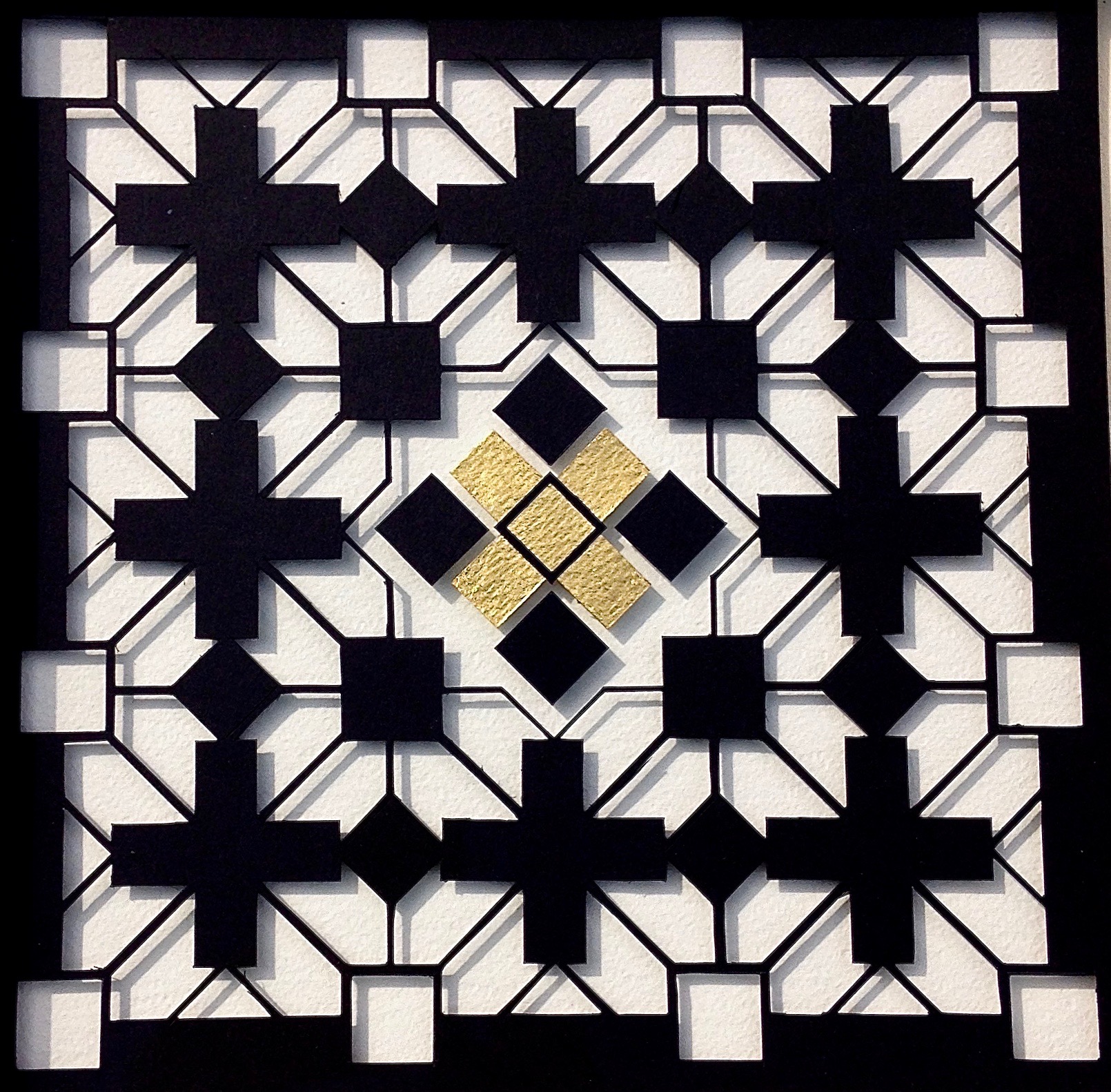  20cm x 20cm Black card, white board, gold leaf.