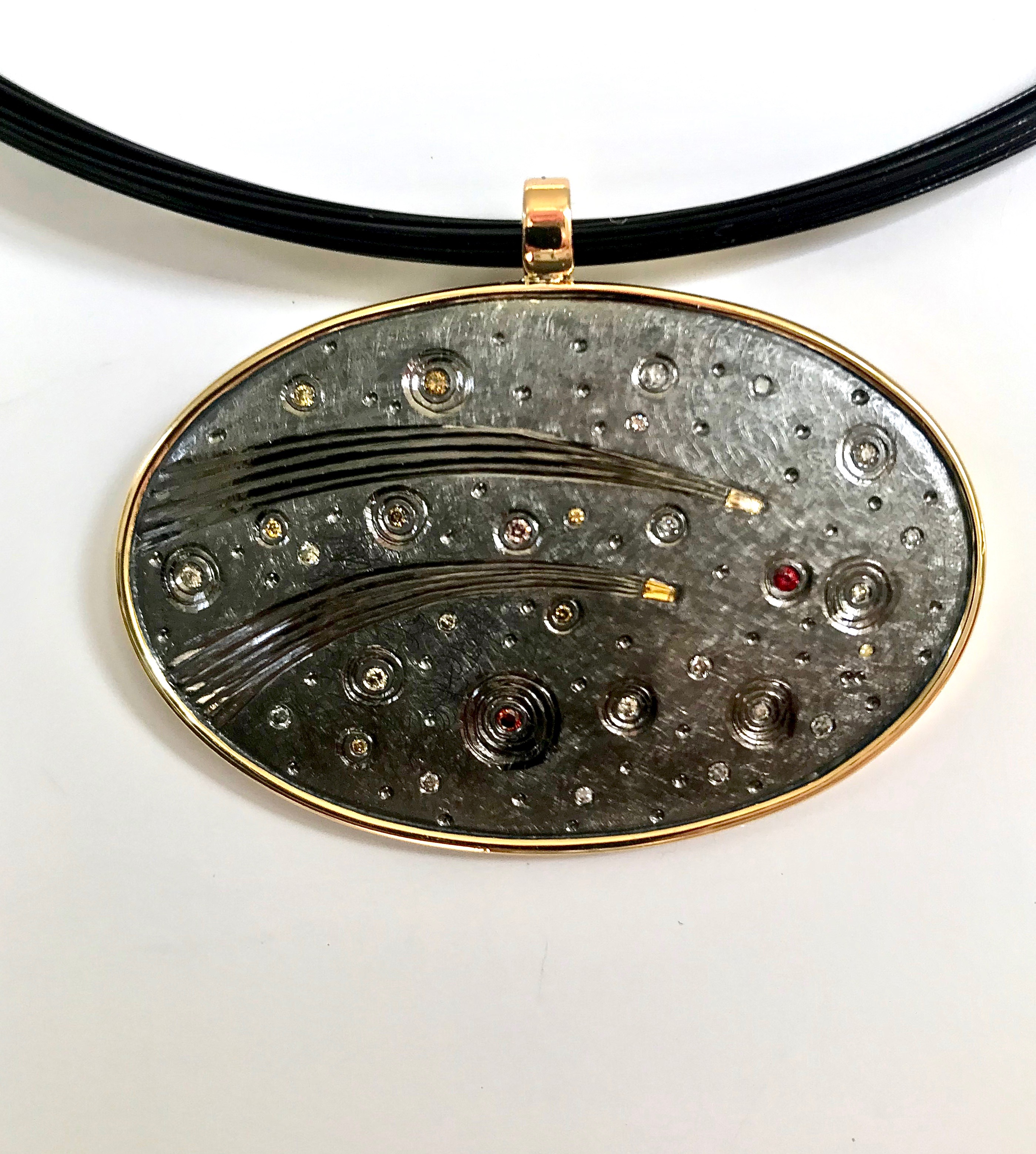50th wedding anniversary commission.18ct gold, silver, hand engraved, set with various coloured diamonds, finished in black rhodium plate.