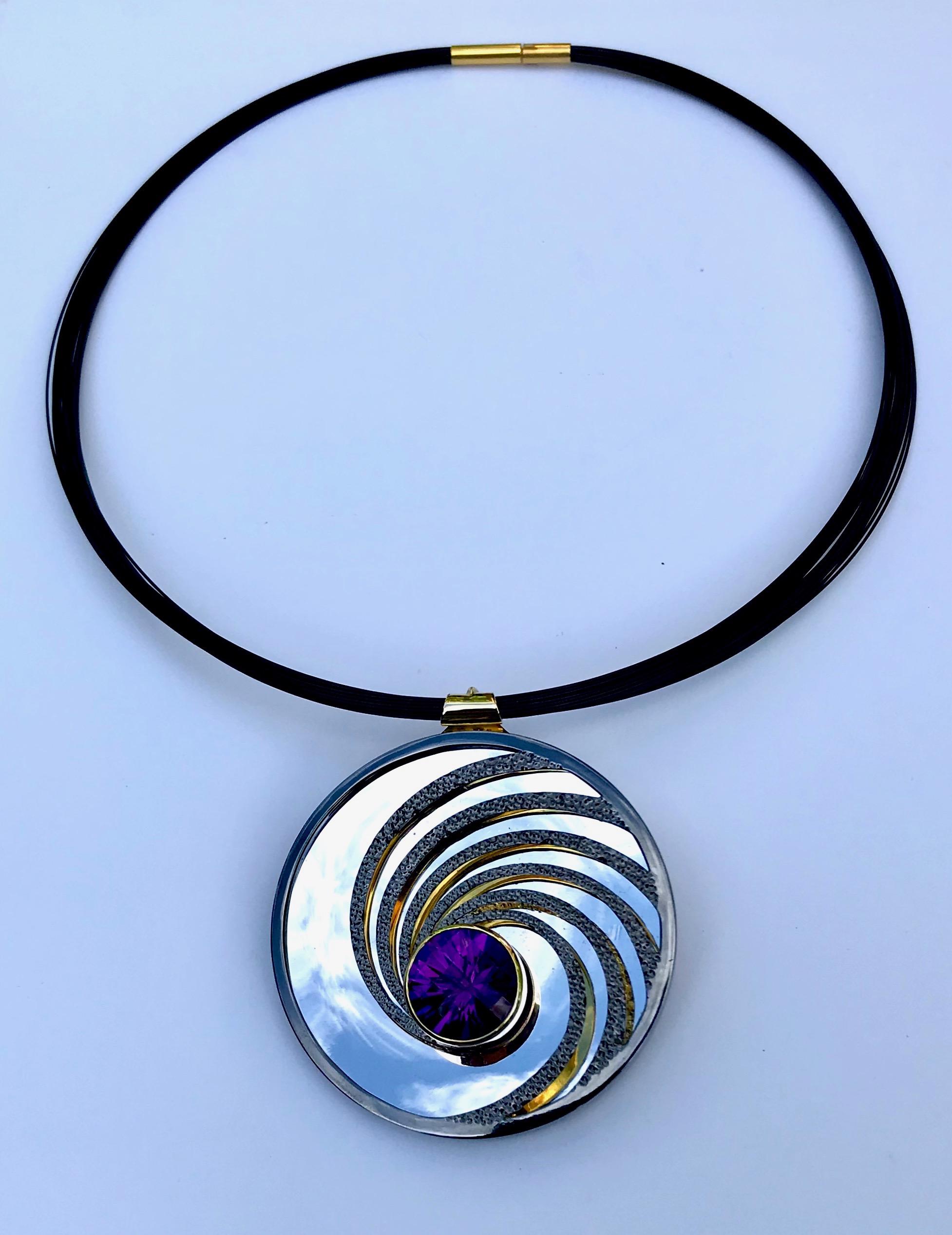 <a href="/node/296">Swinging on a Star. Dark Amethyst / Silver / Part Gilded part Rhodium Plate / the mirror on the inside back will reflect whatever its facing - here it’s the Sky.</a>