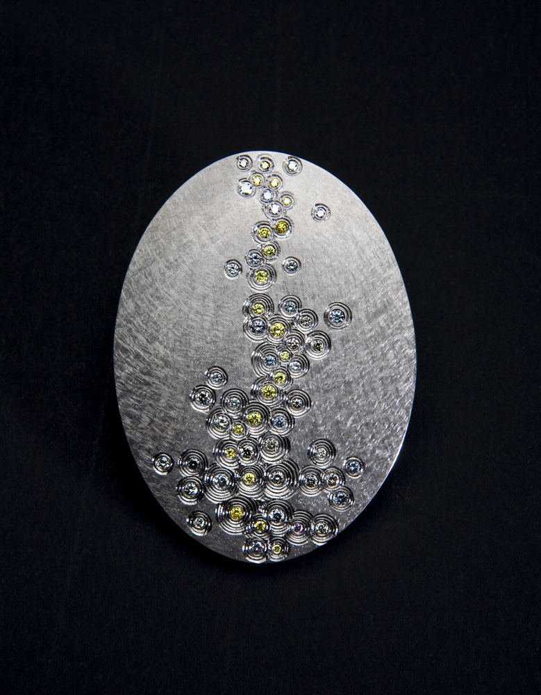 18ct white gold, hand engraved, set with natural grey and yellow diamonds. Photo: Simon B Armitt.