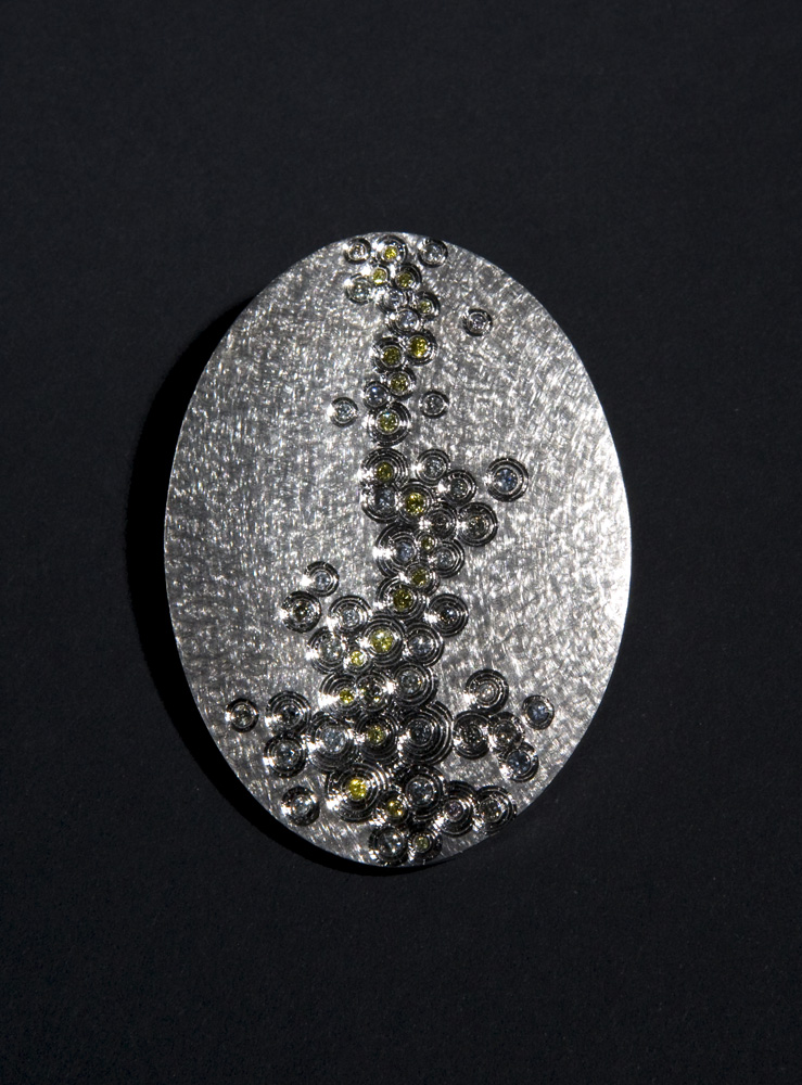 18ct white gold. hand engraved, set with natural grey and yellow diamonds. Photo: Simon B Armitt.