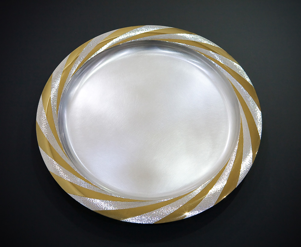 Silver, hand engraved and polished part gilded. 36 cm diameter. 2008.Photo: Simon Armitt