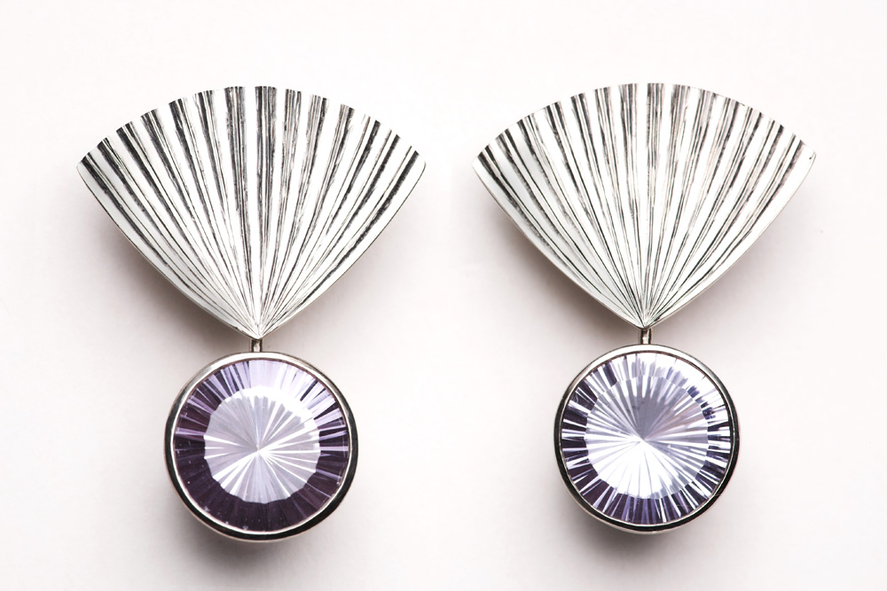 18ct white gold, hand carved ,set with pair sun-cut pale mauve amethysts. 