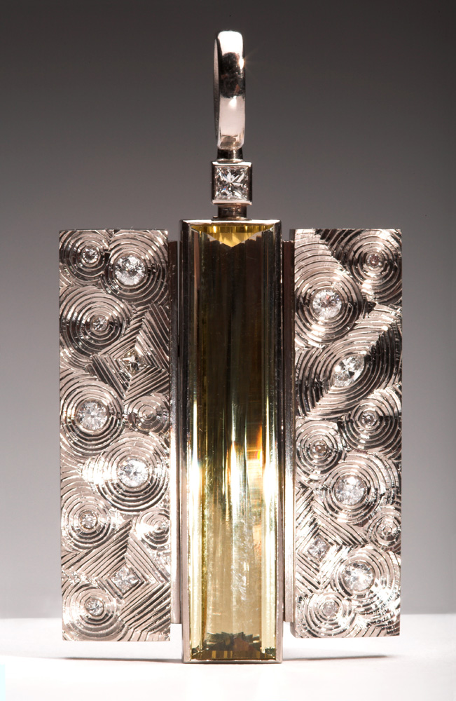 18ct white gold, set with clients diamonds, centre stone pale yellow beryl baguette. 5cm high x 2.8cm wide. Photo: Simon B Armitt.