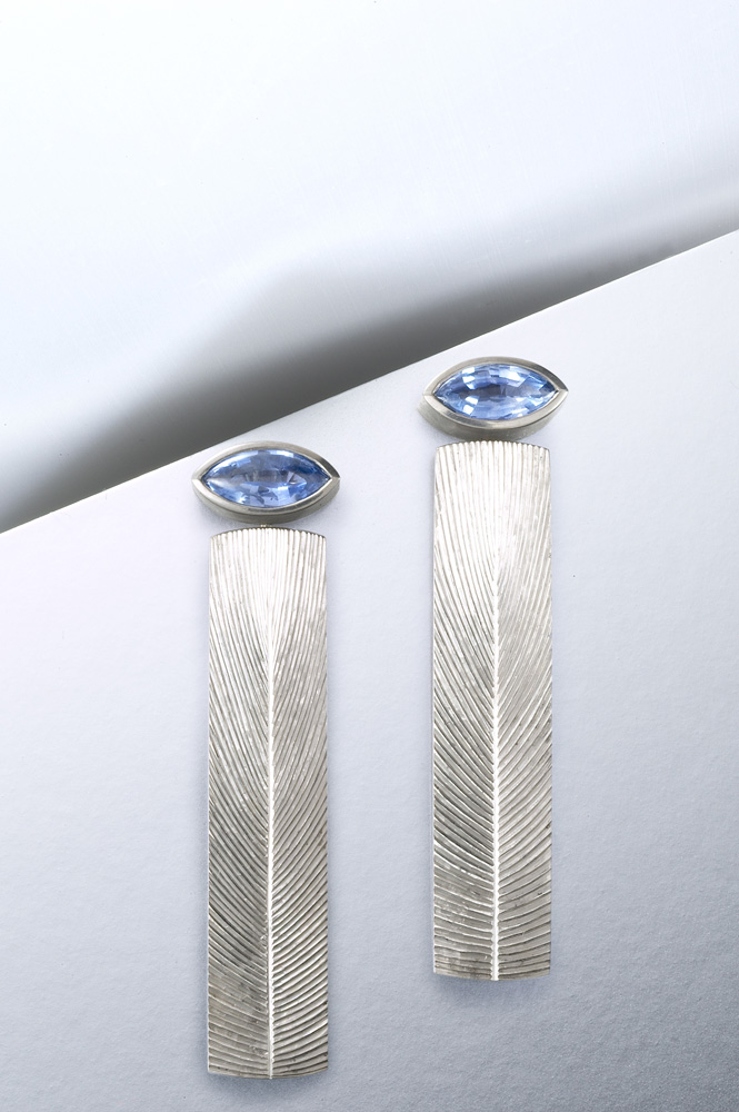 18ct white gold, hand engraved, set with marquise 'buff top' sapphires. 42mm. Photo: Paul Hartley