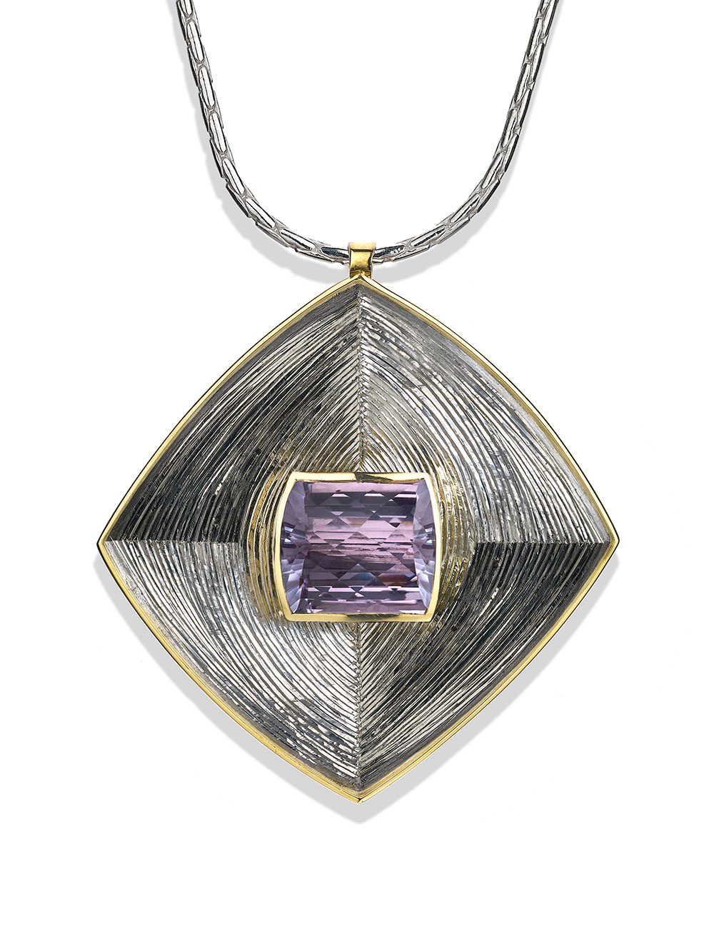 <a href="/node/271">Square Pendent : Silver, hand engraved, Set with large Pale Amethyst in 18ct Gold. photo : Simon B Armitt</a>