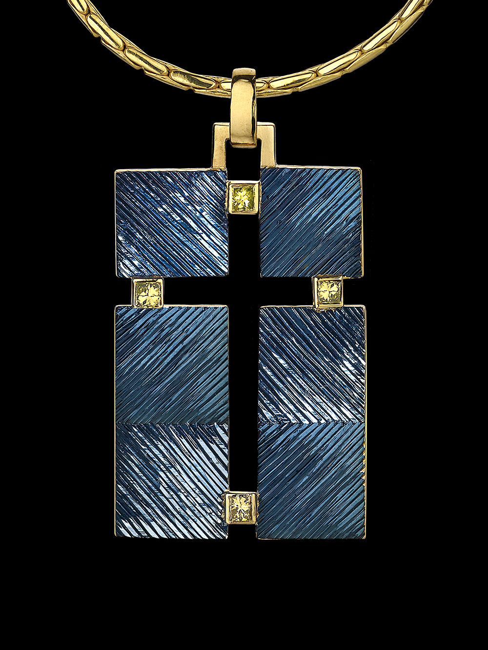 Silver and 18ct gold, gilding and rhodium plate, hand engraved. Set with four square treated yellow diamonds.Photo: Simon B Armitt 