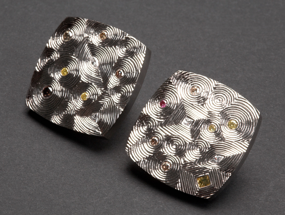 18ct white gold set, with various white and coloured diamonds. Clip Fittings. Size: 20mm square. Photo: Simon Armitt