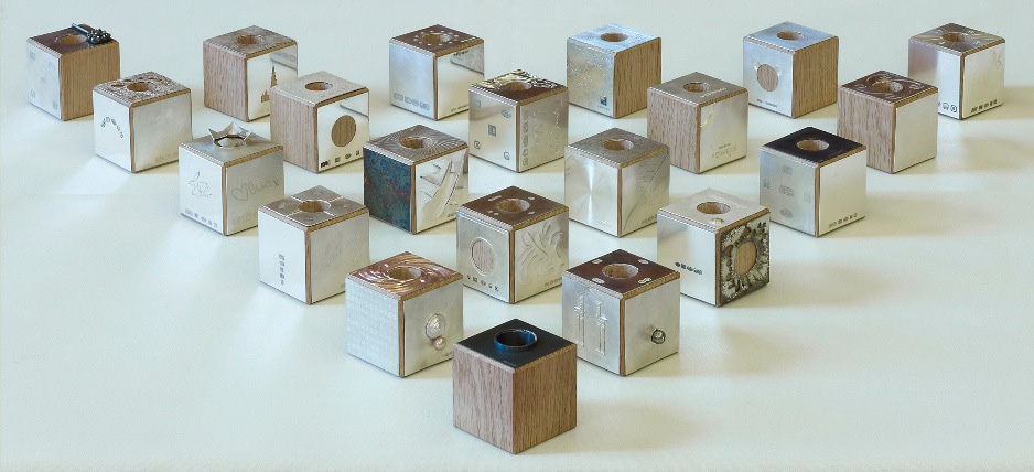 21 Oak cubes with Goldsmiths' Fair exhibitors providing individual squares to cover each side. 5.5cm squarePhoto: Simon B Armitt