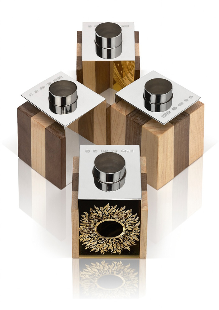 Two pairs. Each cube 5.5cm square. Silver finished in grey rhodium, part hand engraved, part gilded. Wood - English walnut and maple.