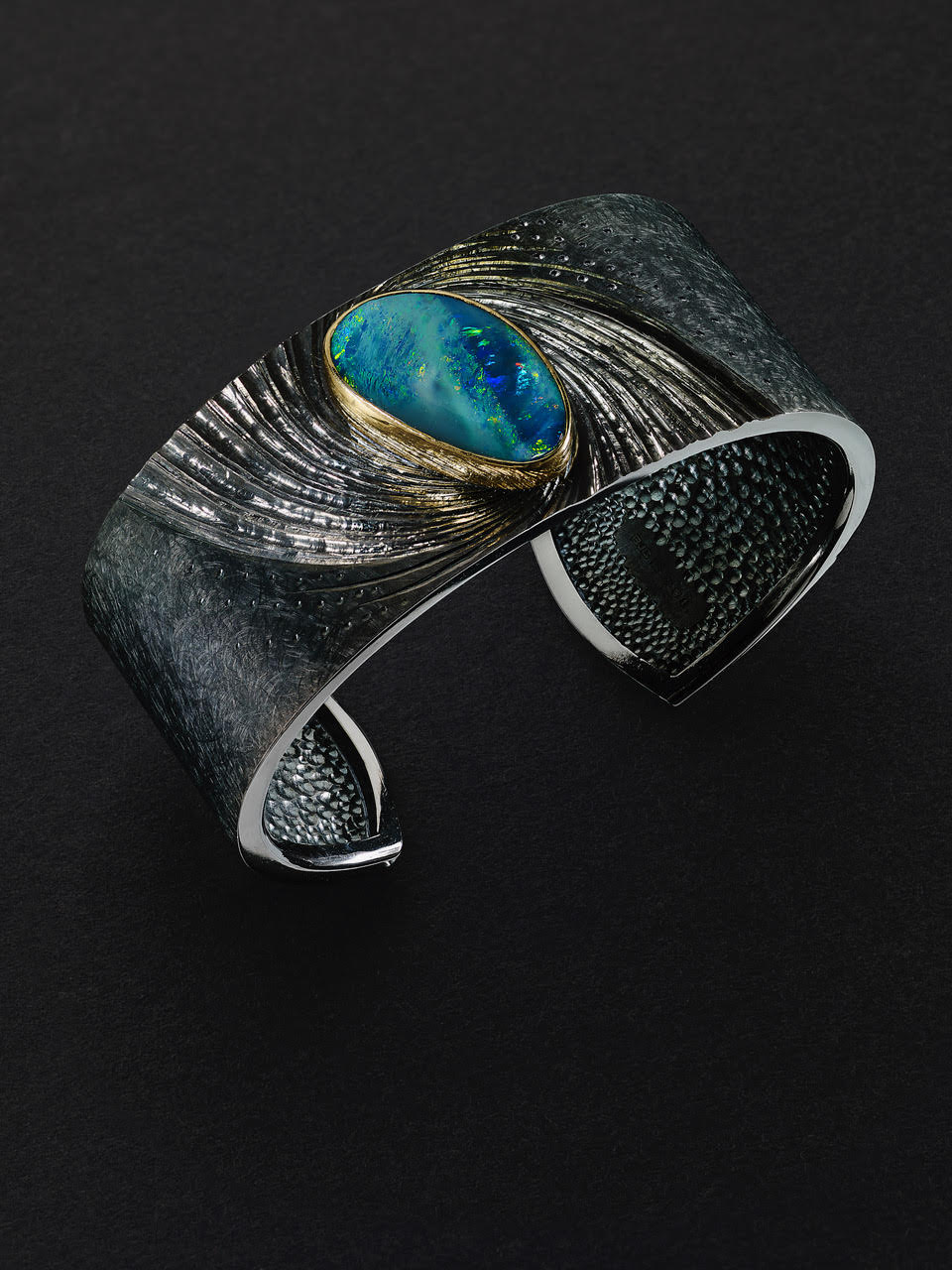 Silver, hand engraved and black rhodium plated, Australian opal set in 22ct gold.Photo: Simon B Armitt.