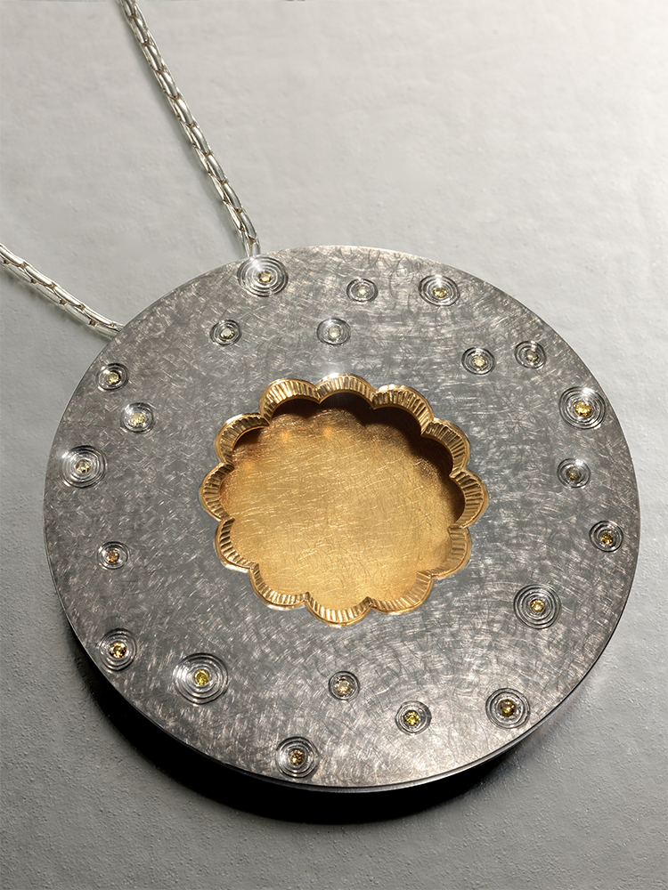 Silver, 22ct gold gilding finished in grey rhodium, set with yellow/green natural diamonds.
