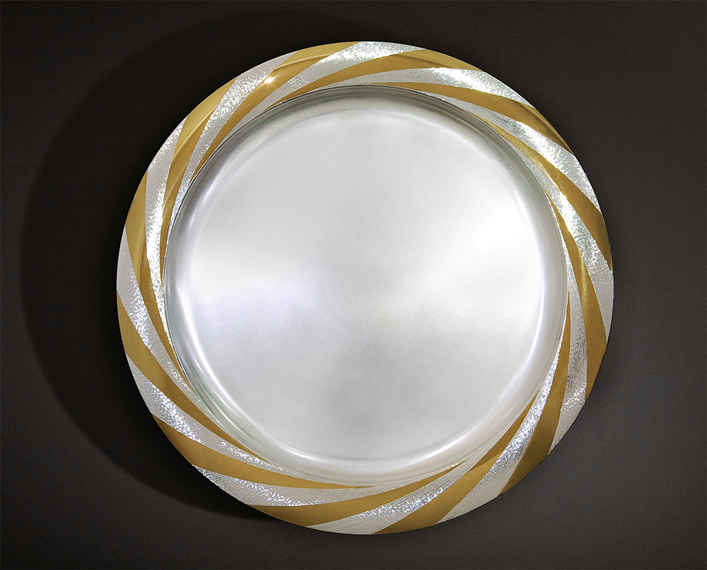 Silver, hand engraved and polished, part gilded, 36cm diameter. 2008. Photo: Simon B Armitt
