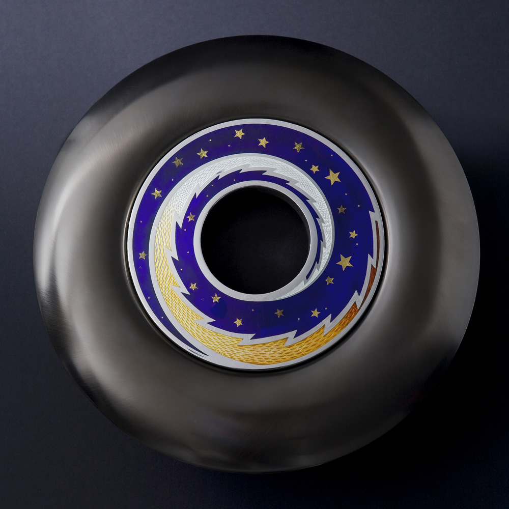 <a href="/jewellery/spinning-pomander-source-love-2008-silver-enamel-black-gilding-optical-quartz-base-30cm">SPINNING POMANDER : &quot;SOURCE OF LOVE&quot; 2008. Silver, enamel, black gilding, optical quartz base. 30cm diam. Photo: Simon Armitt</a>