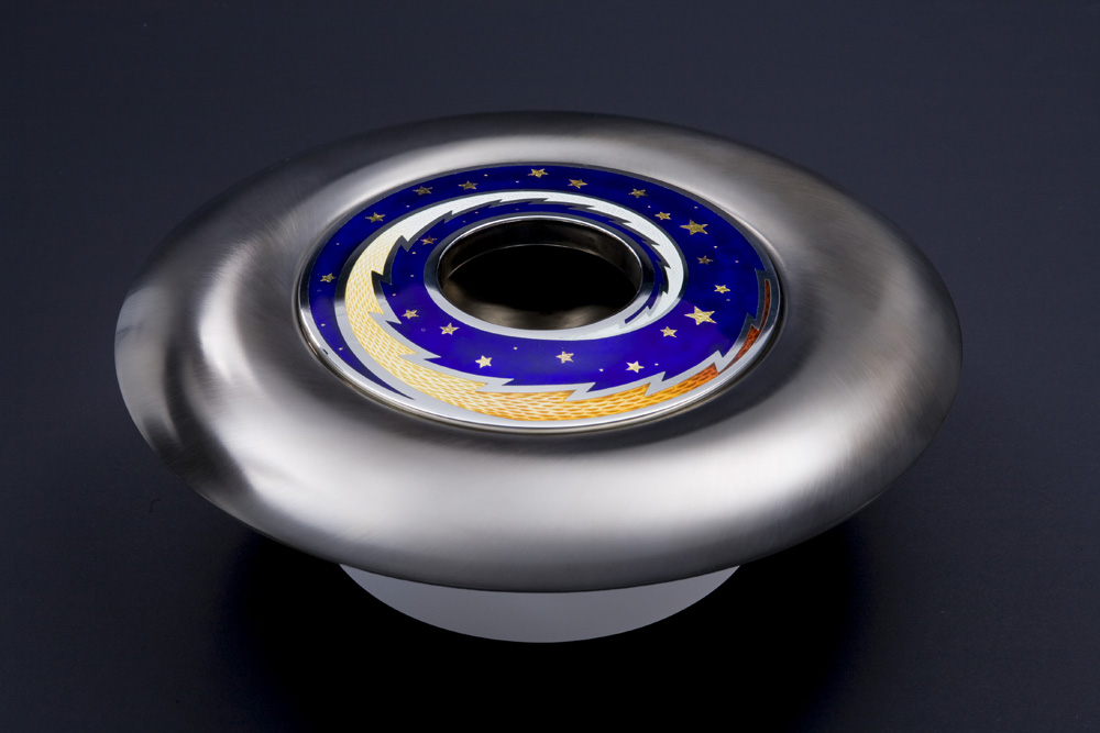 <a href="/jewellery/angle-view-spinning-pomander-source-love-2008-silver-enamel-black-gilding-optical-quartz">Angle view: SPINNING POMANDER : &quot;SOURCE OF LOVE&quot; 2008. Silver, enamel, black gilding, optical quartz base. 30cm diam. Photo: Simon Armitt</a>