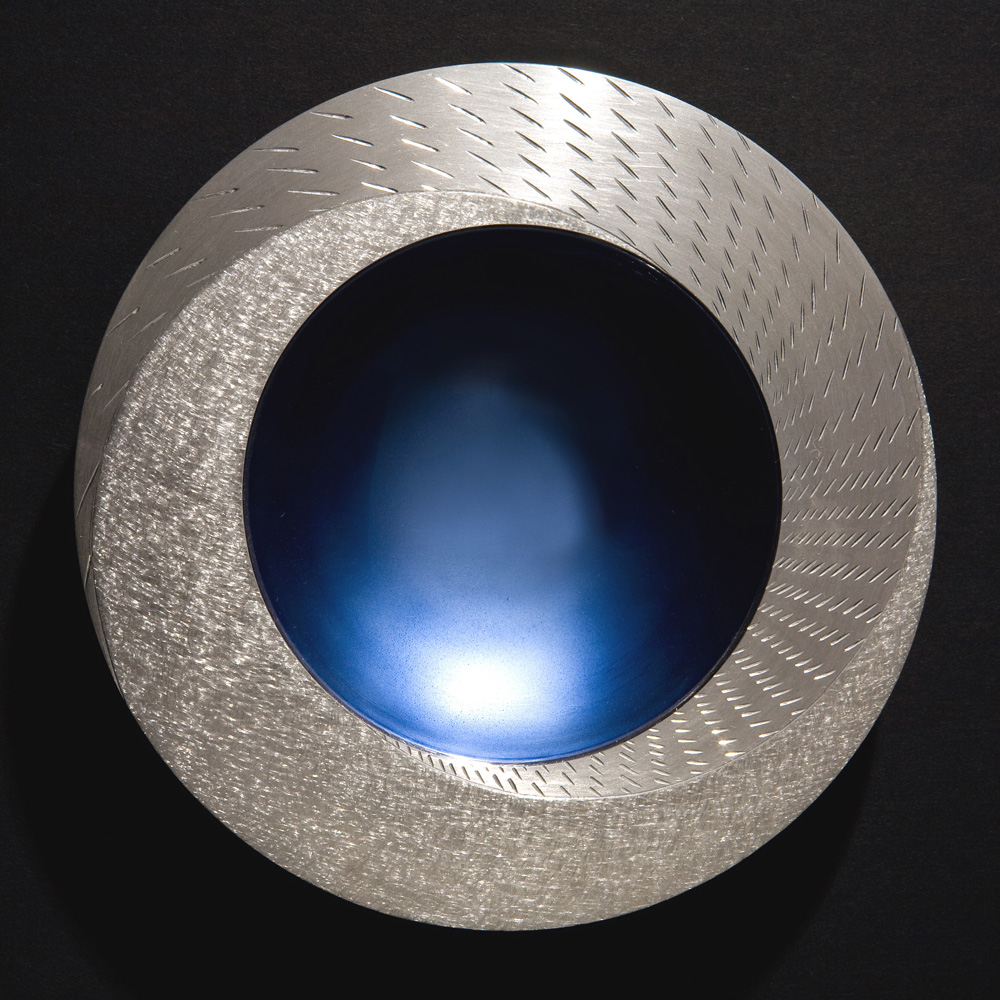 RAIN SPINNING BOWL 2008. 150 mm diameter. Brittannia Silver, Moonstone Blue enamel, white marble. Photo: Simon Armitt