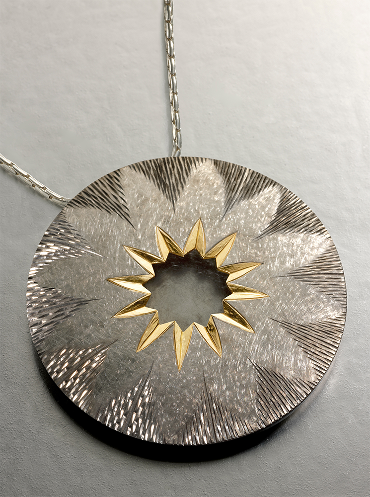 Silver, hand engraved and carved, 18ct gilding, finished in grey rhodium.